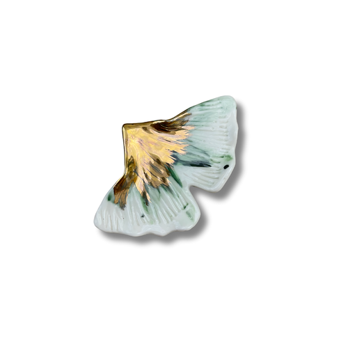 Ginkgo leaf brooch with gold on a white background
