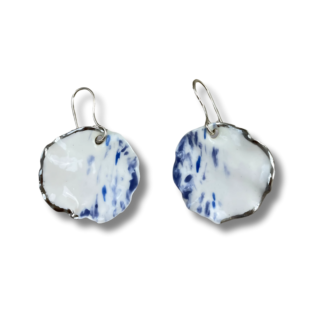 Pair of earrings with a blue and white design on a white background