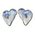 Heart-shaped earrings with a blue and white design on a white background