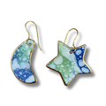 Pair of earrings with blue and green marbled design on a white background